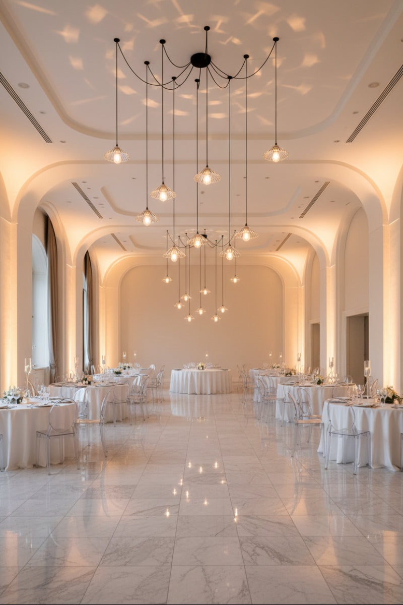 9 drop chandelier with cord mounting plates and clear glass pleated shades. in event space