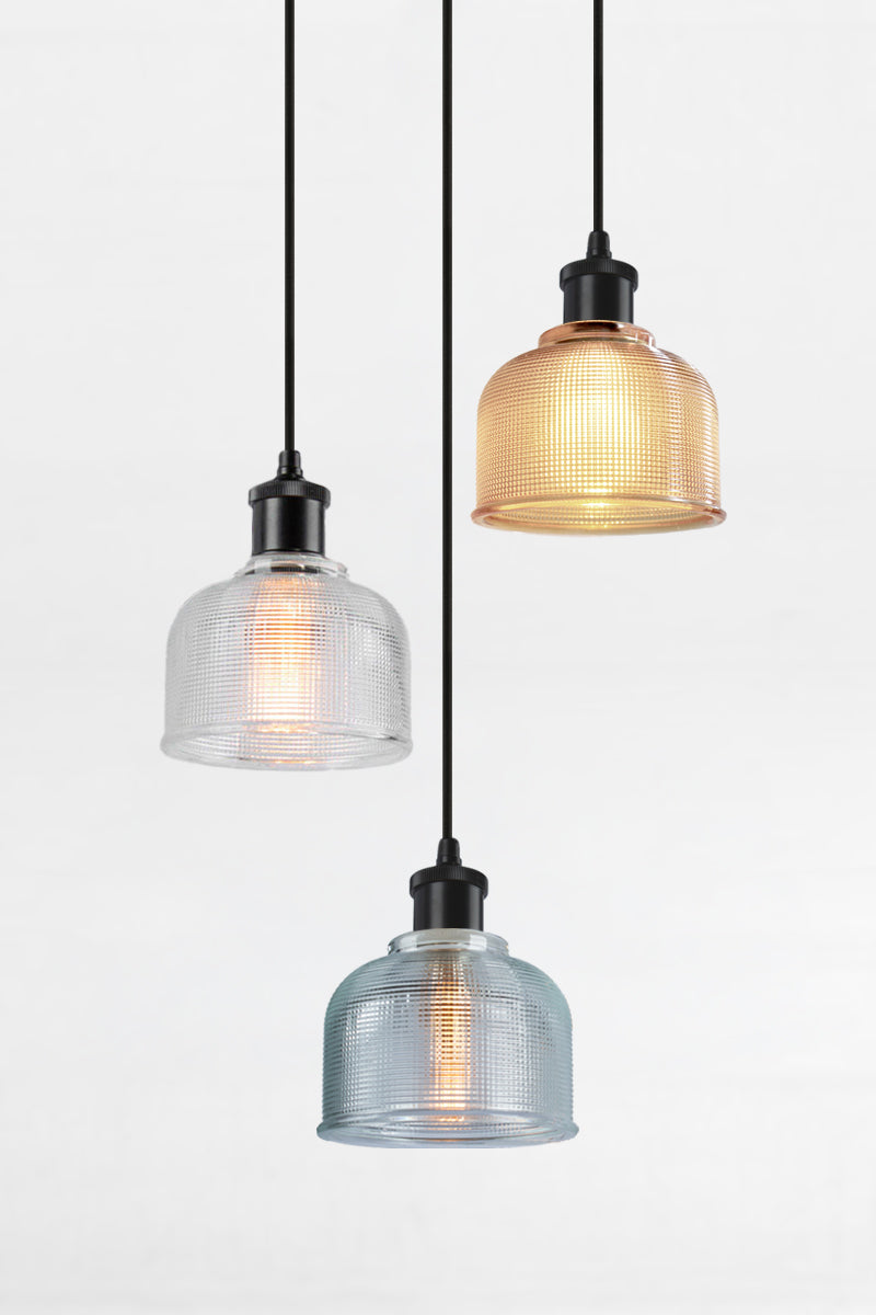 3 light multi pendant with black ceiling rose, black pendant cords and crosshatch glass shades in amber, clear and blue. 