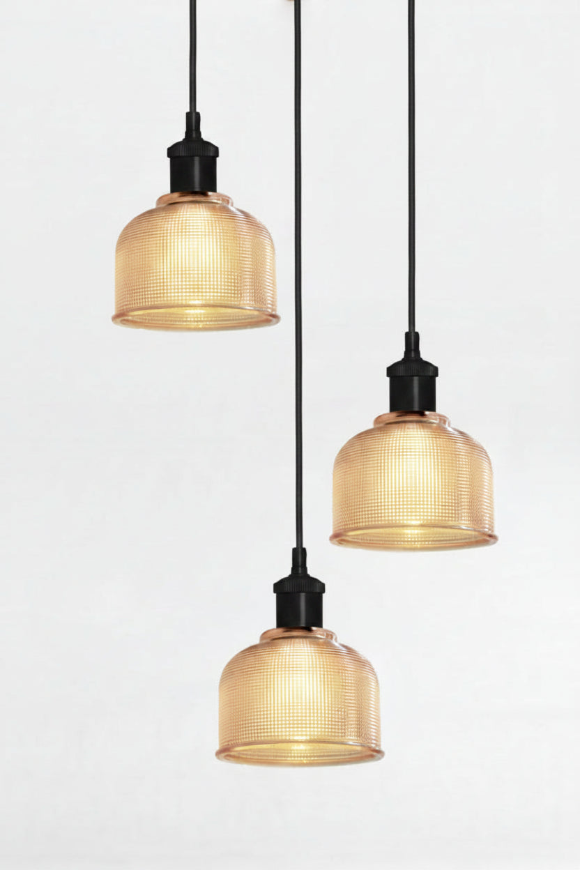 3 light multi pendant with black ceiling rose, black pendant cords and crosshatch glass amber shades. 