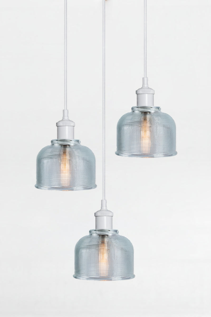 3 light multi pendant with black ceiling rose, white pendant cords and crosshatch glass blue shades. 