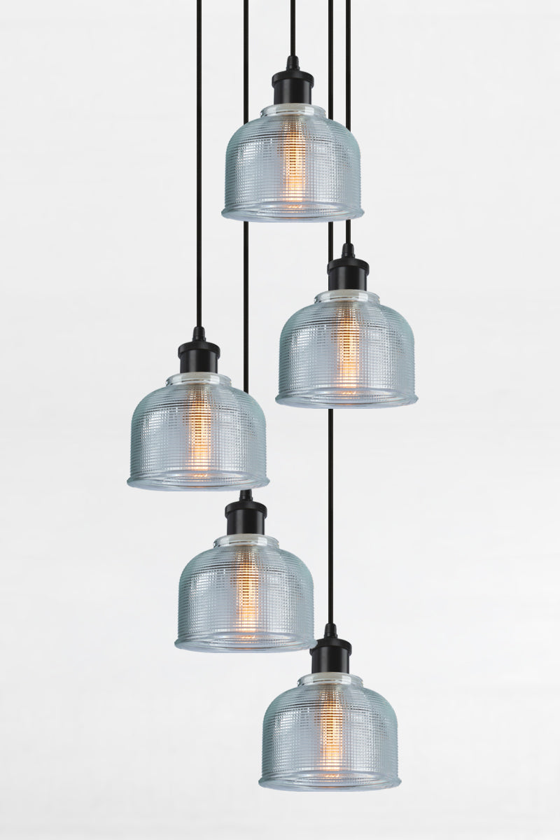 5 light multi pendant with black ceiling rose, black pendant cords and crosshatch glass blue shades. 