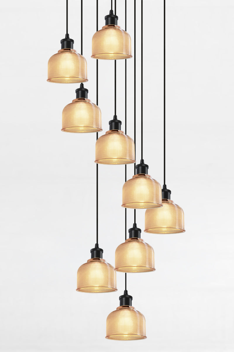 9 light multi pendant with black ceiling rose, black pendant cords and crosshatch glass amber shades. 