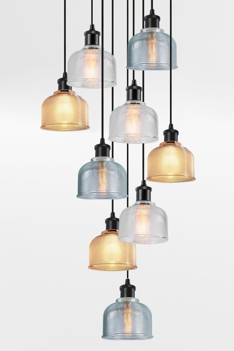 9 light multi pendant with black ceiling rose, black pendant cords and crosshatch glass shades in amber, clear and blue. 