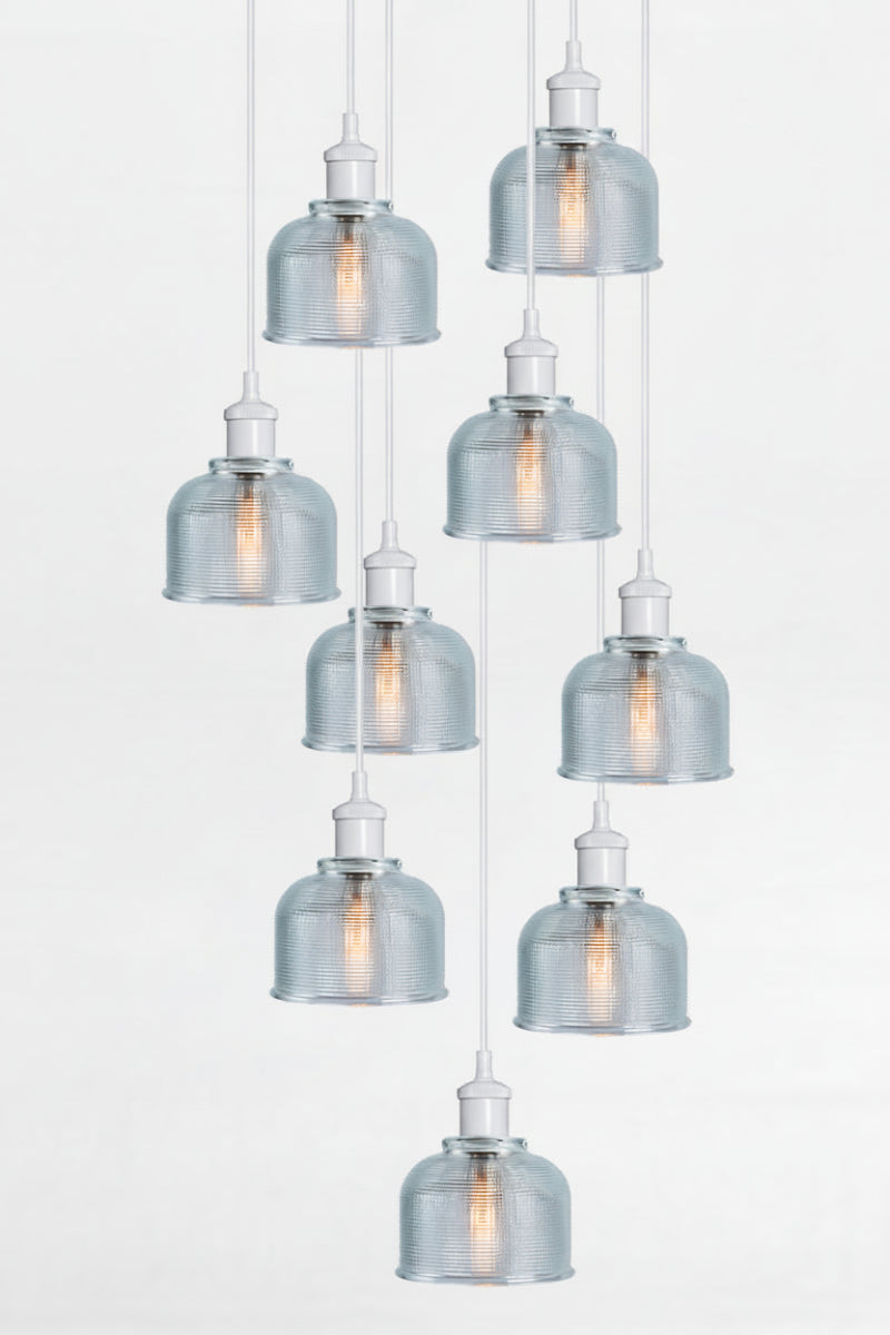 9 light multi pendant with black ceiling rose, white pendant cords and crosshatch glass blue shades. 