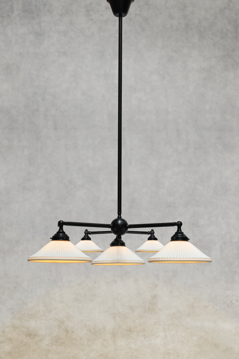 Black steel 5 arm chandelier frame with ceramic shades.