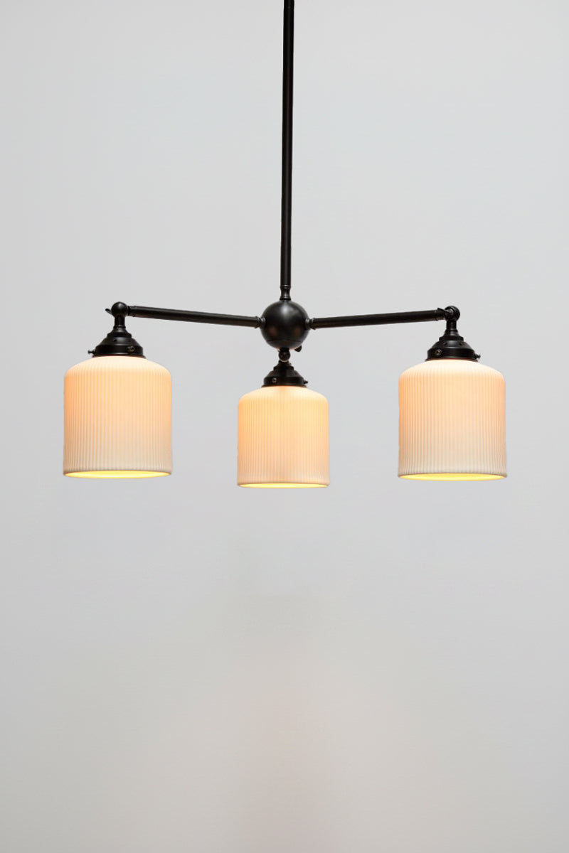 Multi light pendant with black finish and three ceramic shades
