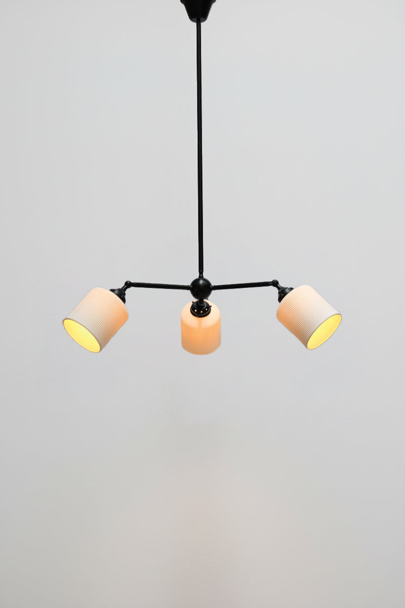 Multi light pendant with black finish and three angled ceramic shades