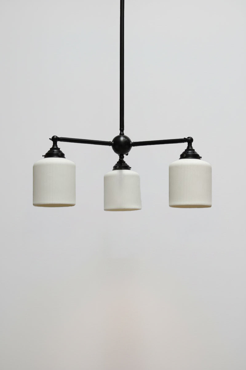 Multi light pendant with black finish and three ceramic shades