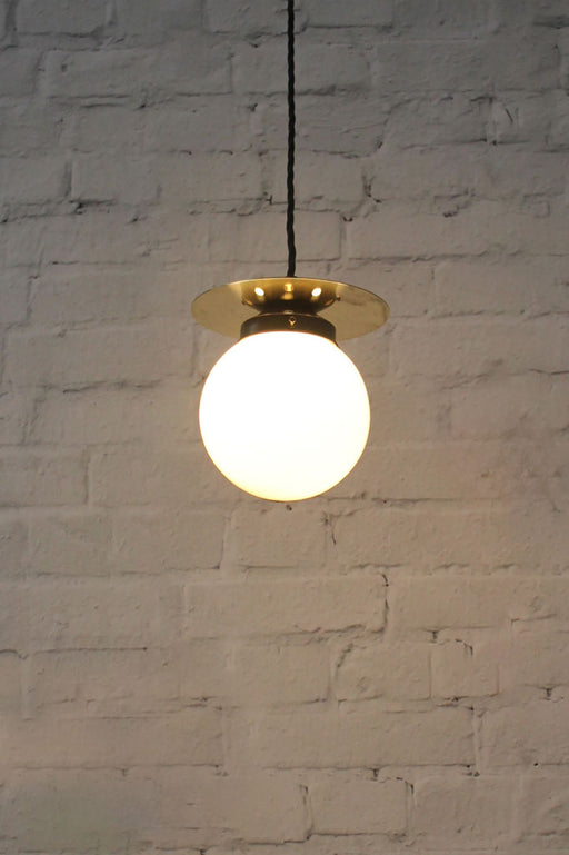 Opal small pendant light with gold/brass disc