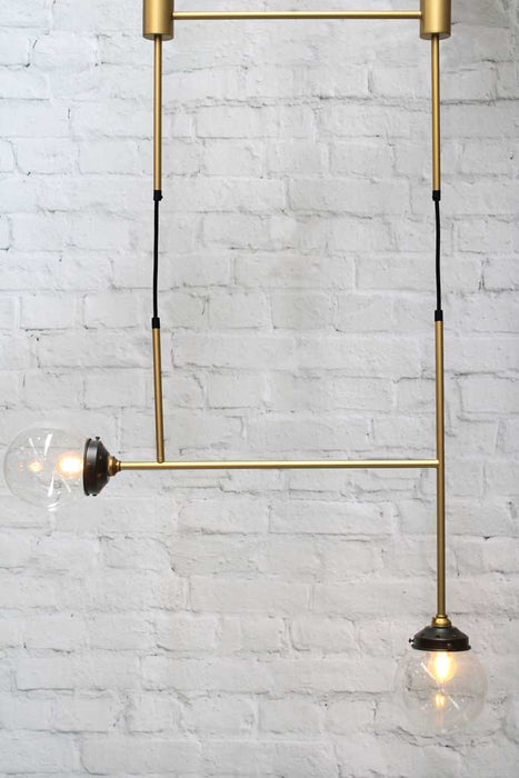 Junction light Brass Gold with A configuration and two clear glass ball shades
