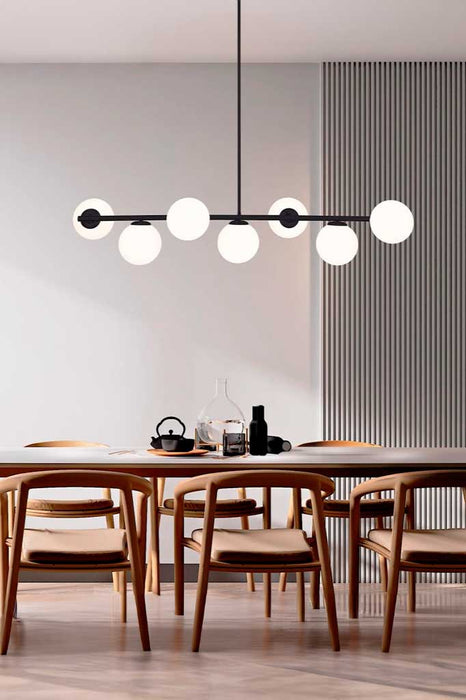 multi light pendant in black over dining table