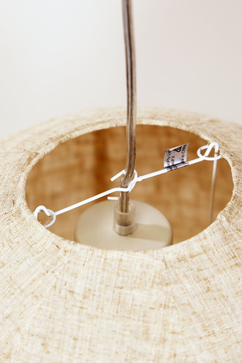 Close up of shade attaching to the pendant cord. 