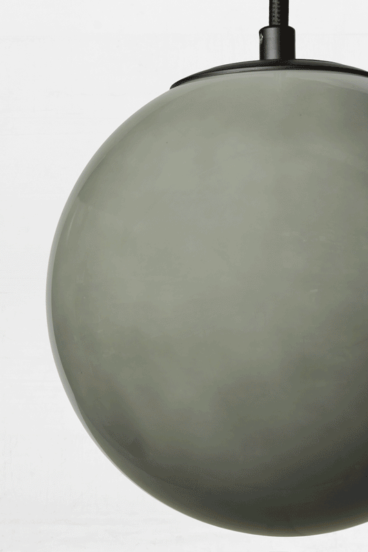 Gif showing the colour change in the light grey glass ball shade. 