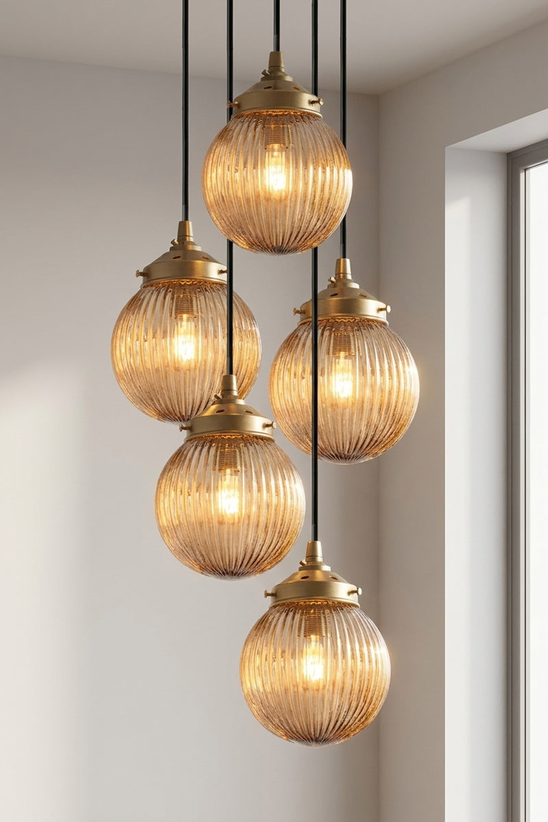 5 drop multi pendent with dark amber reeded glass ball shades. 