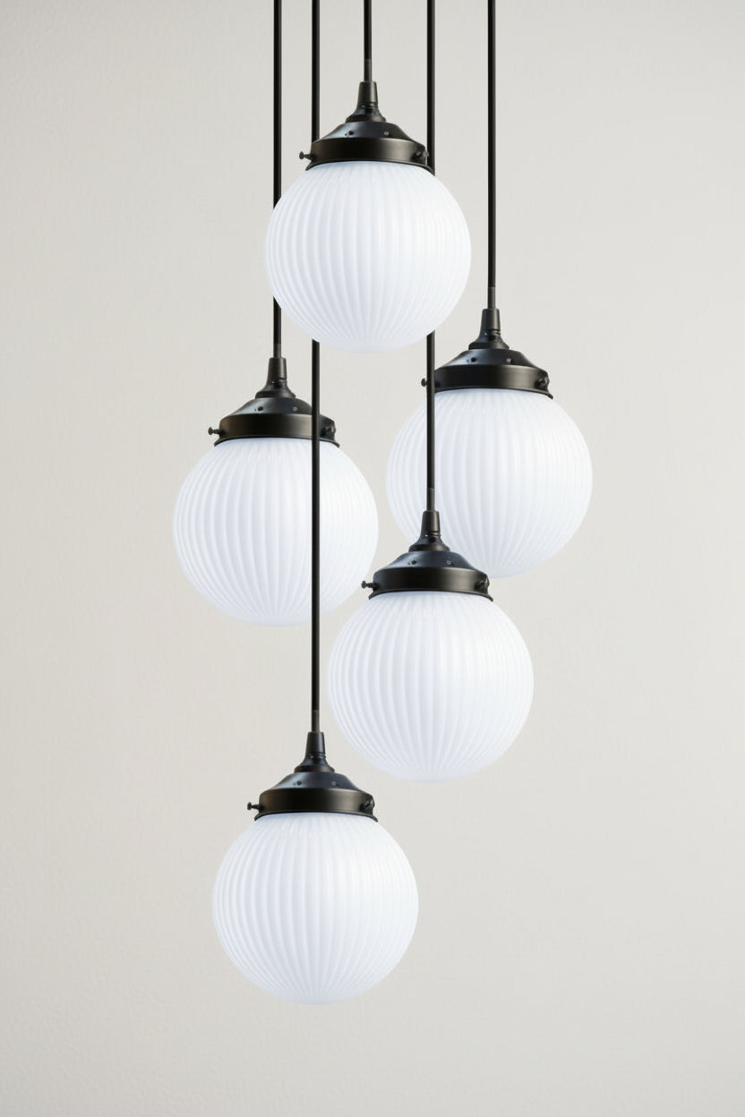 5 light multi drop with opal glass shades on a black fixture