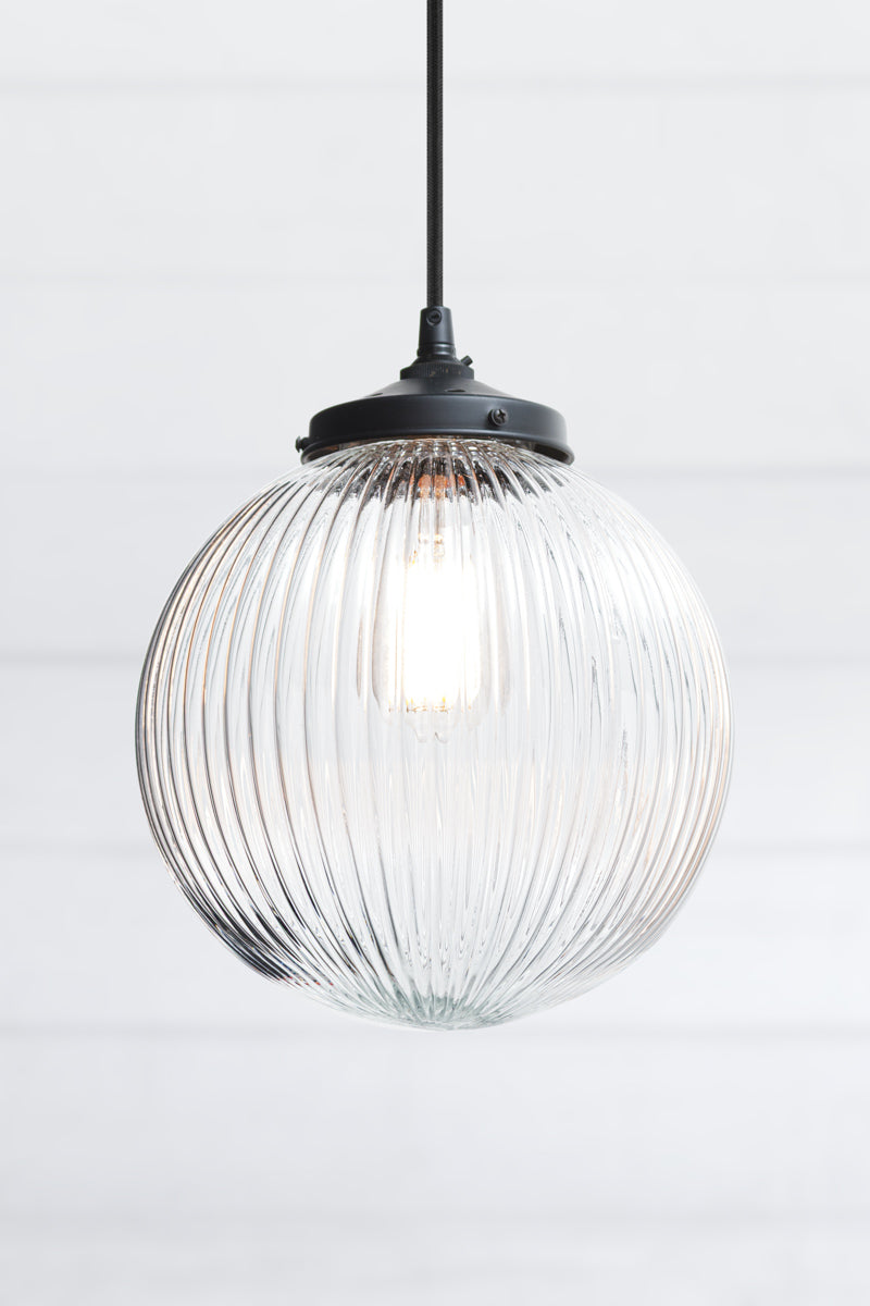 Dakota Reeded Glass Pendant Light medium clear glass on black cord
