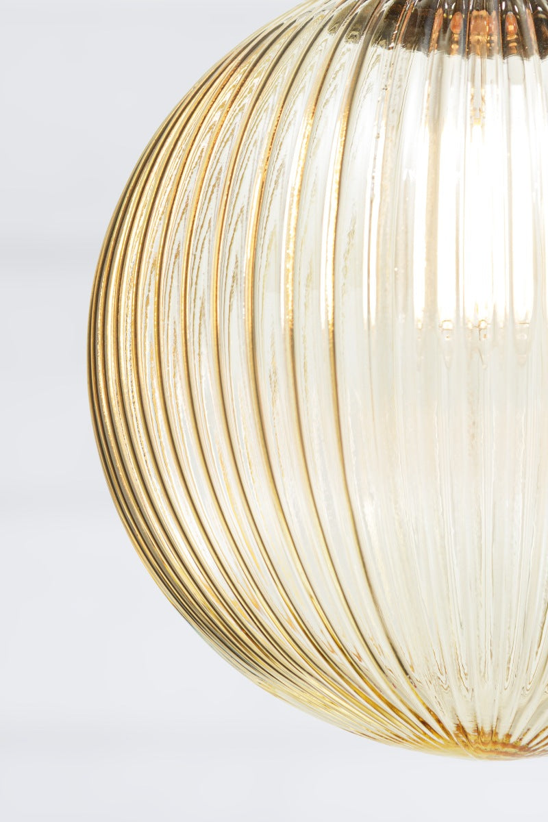Close up of the medium amber reeded glass ball shade. 