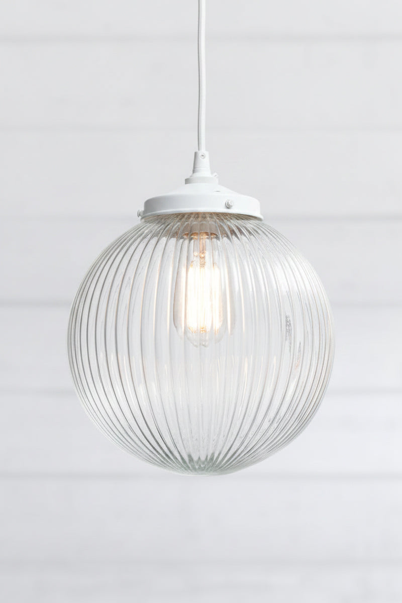 clear reeded glass on pendant light with glass shade and white fitting with white cord 