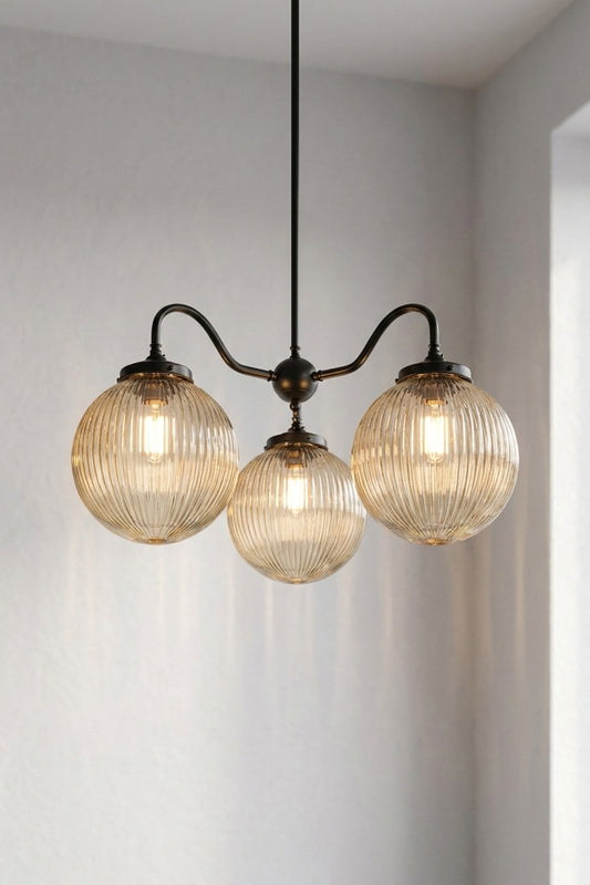 3 arm in black and 3 medium reeded glass shades in amber 