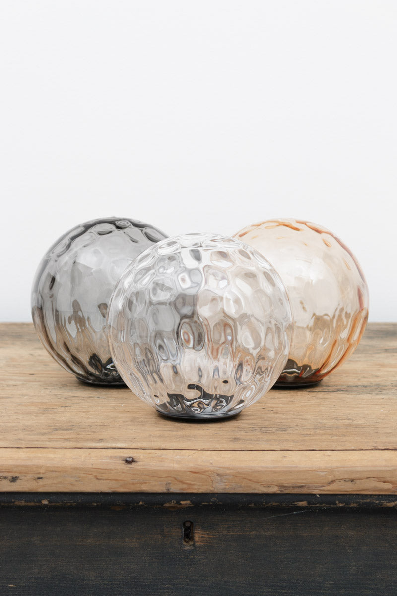 Dimpled glass shades in three finishes; Clear, Amber and Grey. 