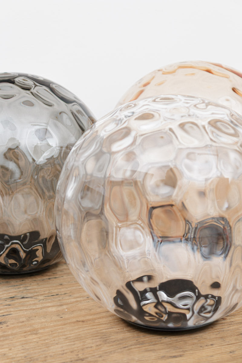 Close up of the dimpled glass shades in three finishes. 