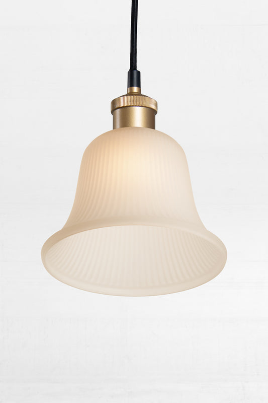 this bell-shaped frosted glass shade has a textured appearance.