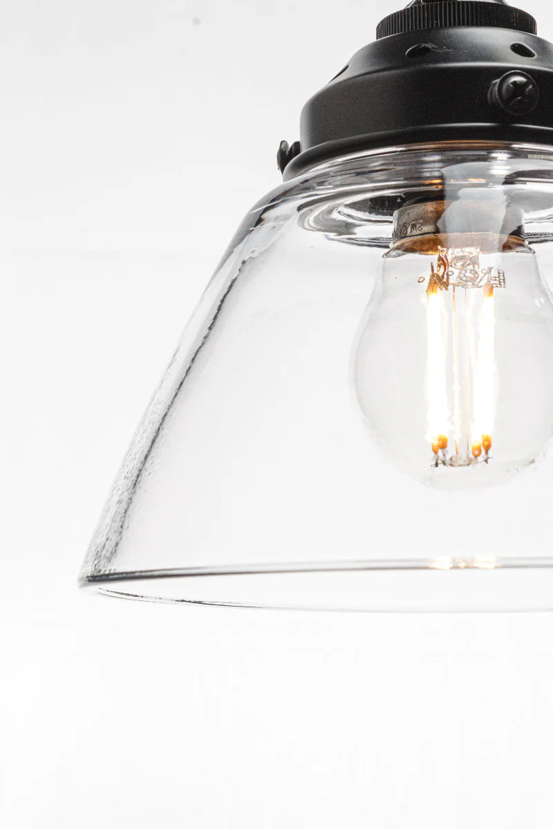 Tapered clear handmade glass shade with a wide opening