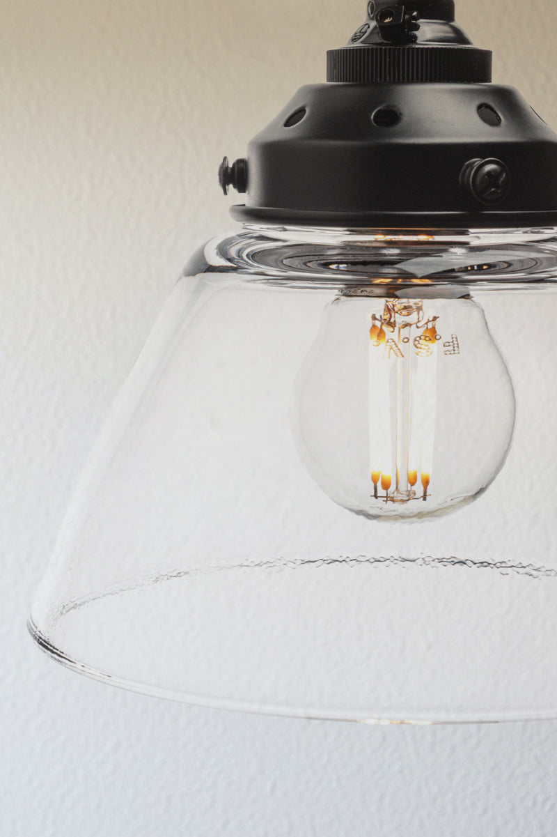Close-up of Belmont clear glass shade with black metal gallery detail