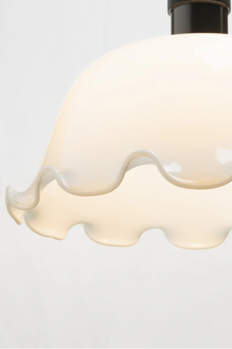 Opal glass and featuring a scalloped edging