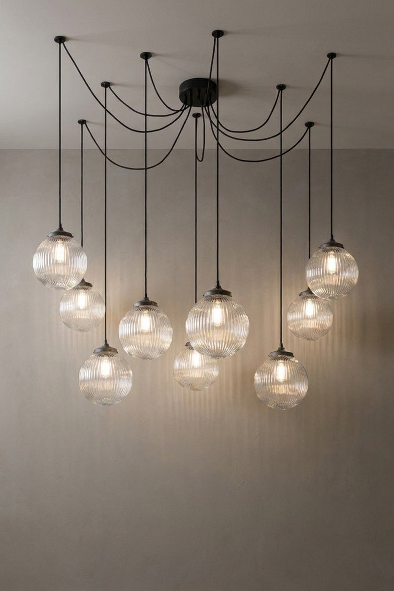 9 drop chandelier with mounting plates and medium clear reeded glass shades.