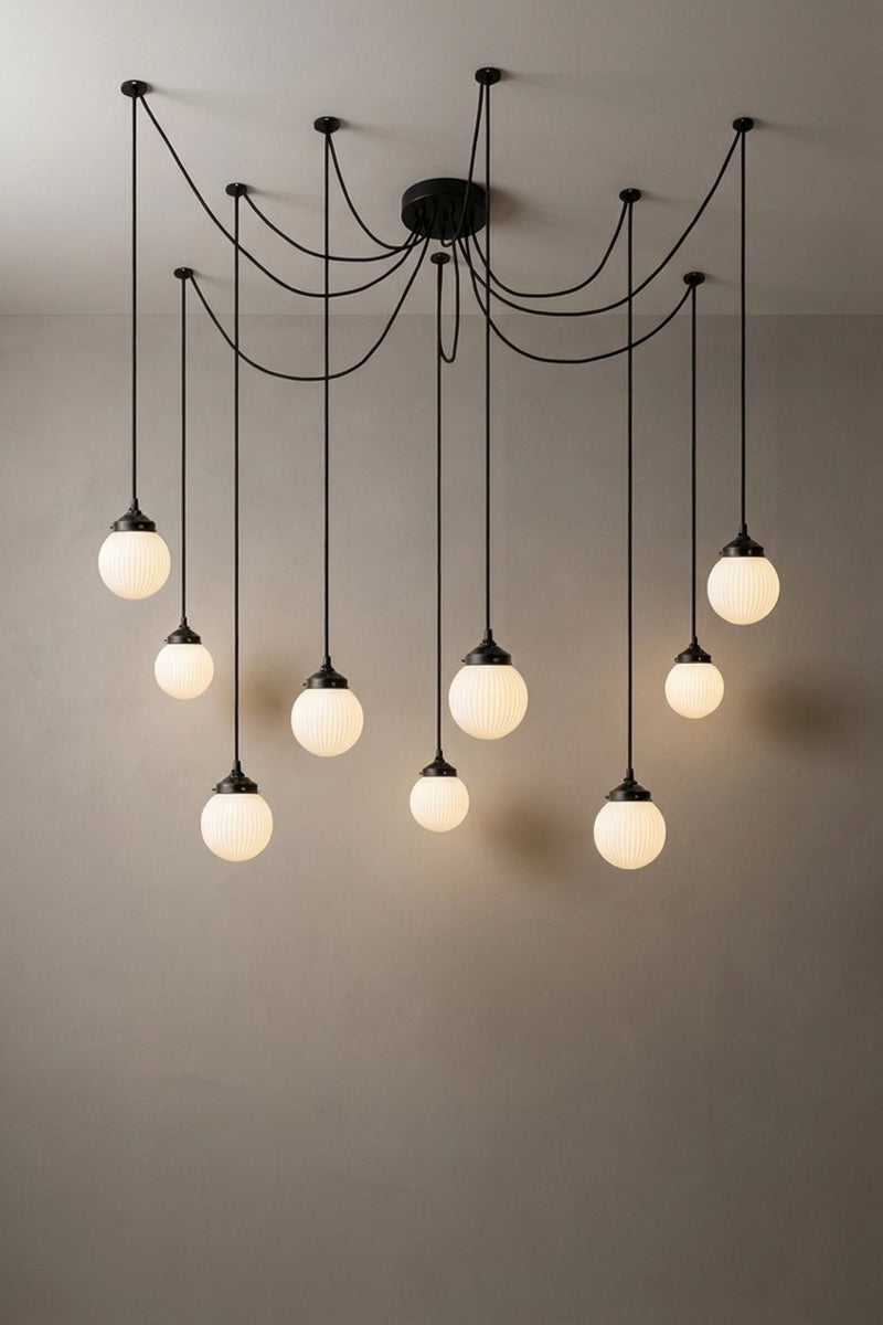 9 drop chandelier with mounting plates and opal reeded glass shades.