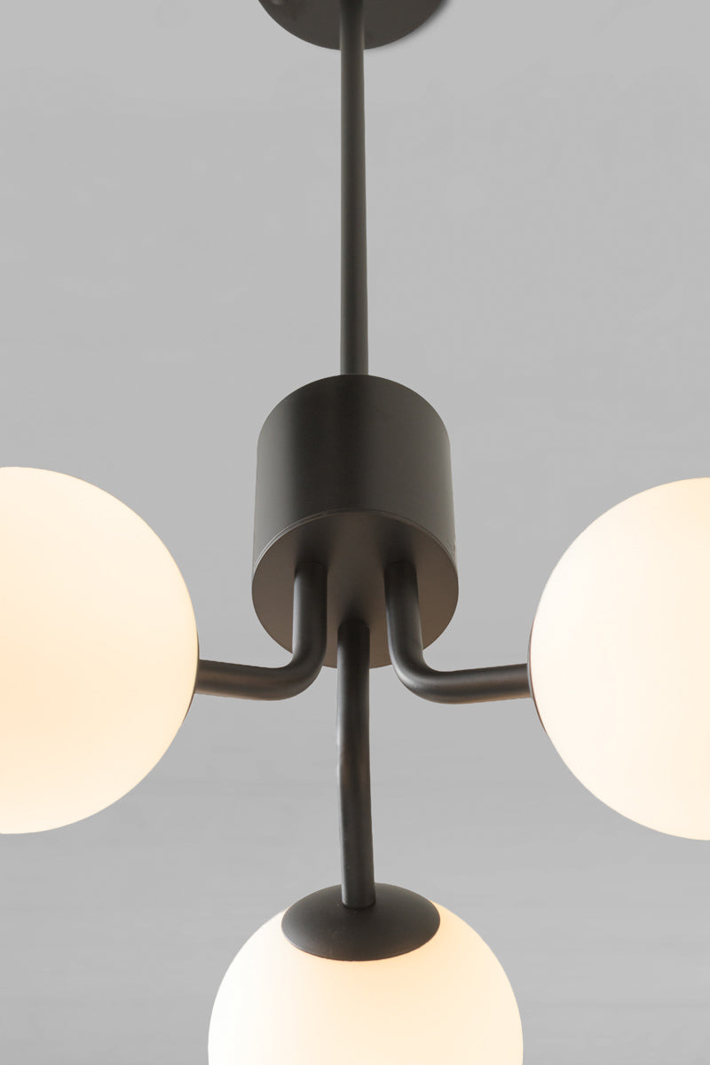 Brooklyn Glass Orb 3 Light Pendant with a matte black metal frame and 3 spherical opal glass shades