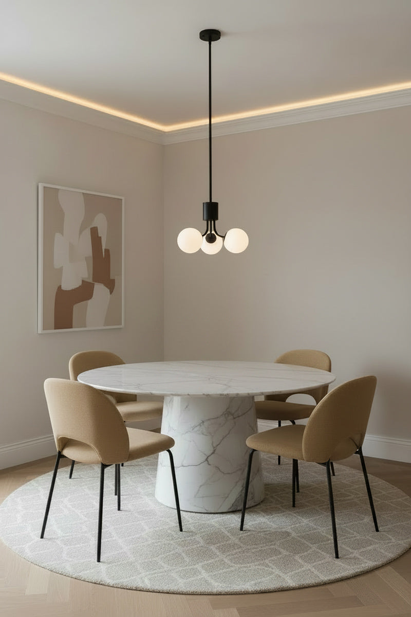 3 opal glass ball orb chandelier on a black fixture in a modern dining room. 