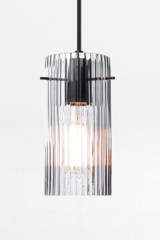 Indiana Glass Pendant Light featuring reeded clear glass and black pendant cord. 
