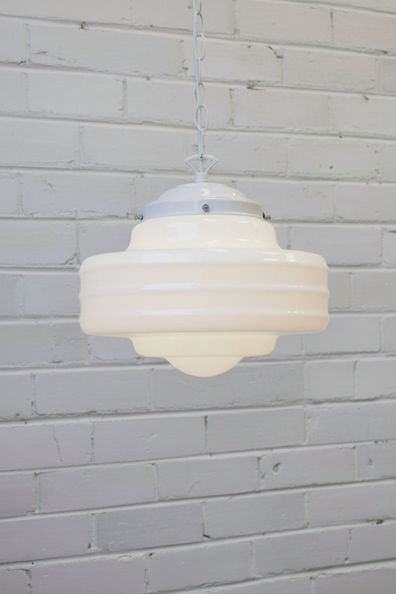 Large opal glass shade on a white chain and cord pendant