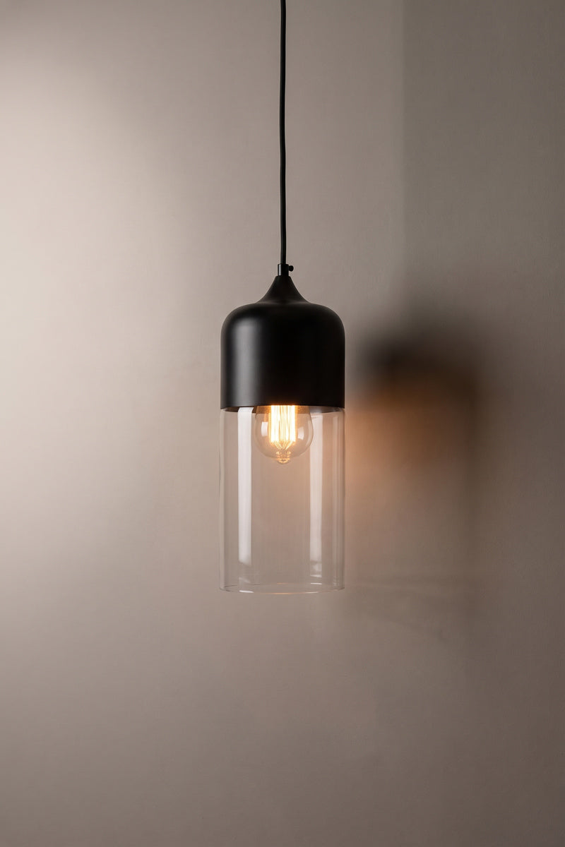 Silhuette C of the Dalston industrial/ modern glass and metal pendant light. Paired with a clear bulb. 