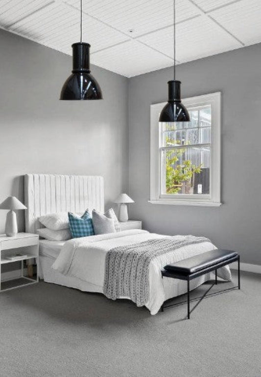 bedroom with large black pendants