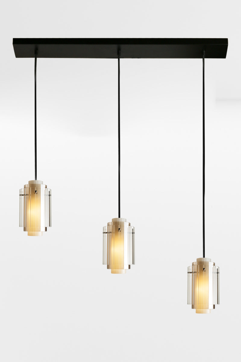 Three cord linear multi light with 3 layered glass shades and black hardware. 