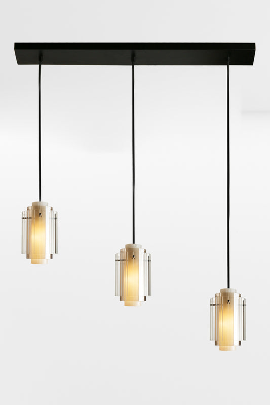 Three cord linear multi light with 3 layered glass shades and black hardware. 