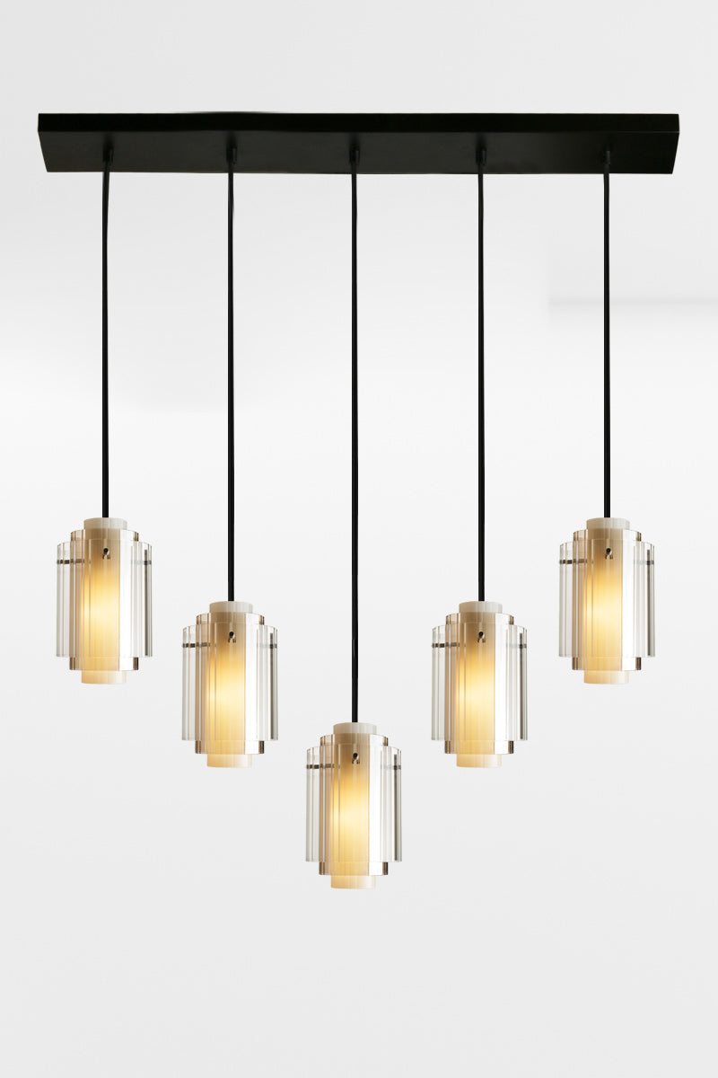 Five cord linear multi light with 5 layered glass shades and black hardware. 