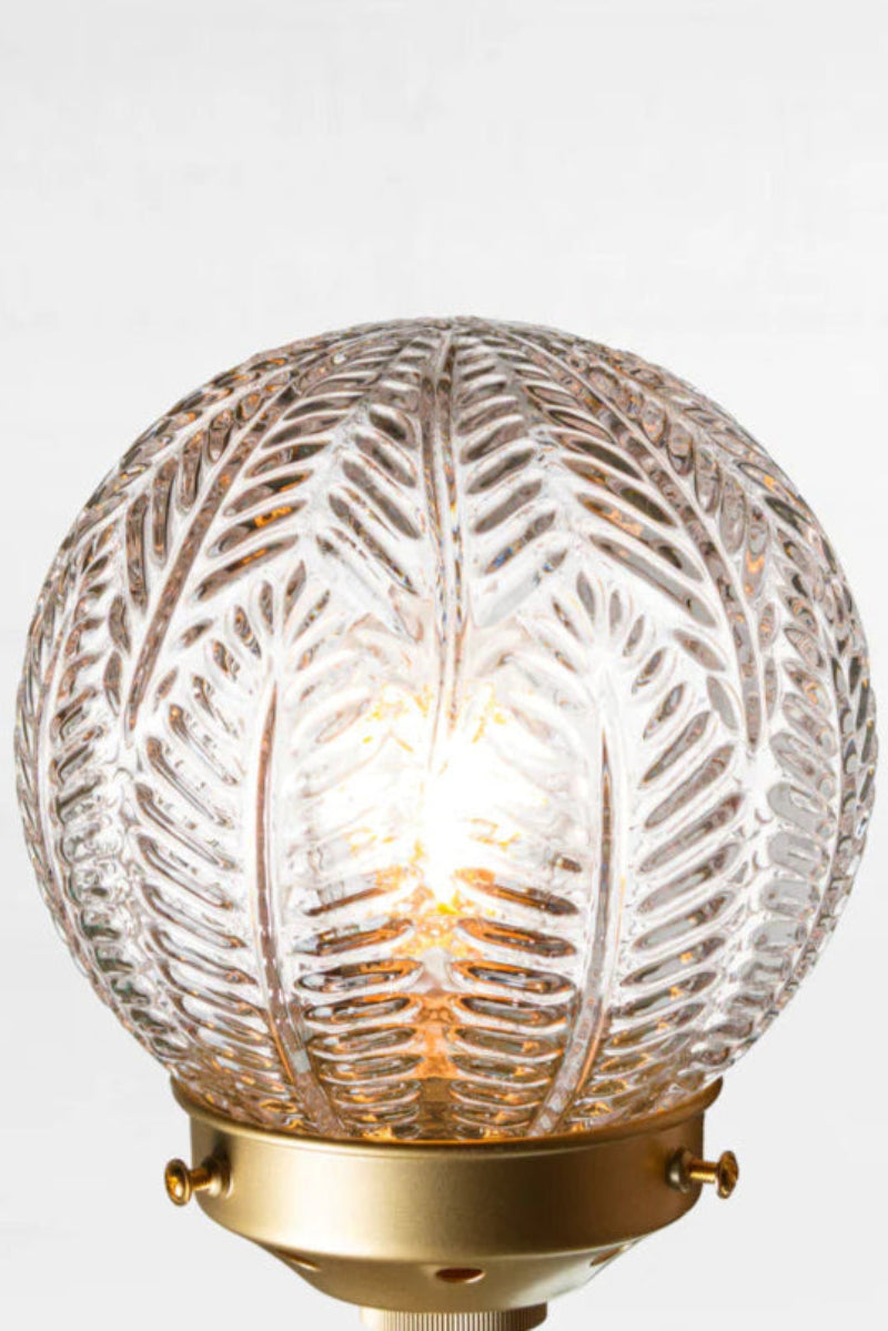 Decorative glass light fixture with gold fitting