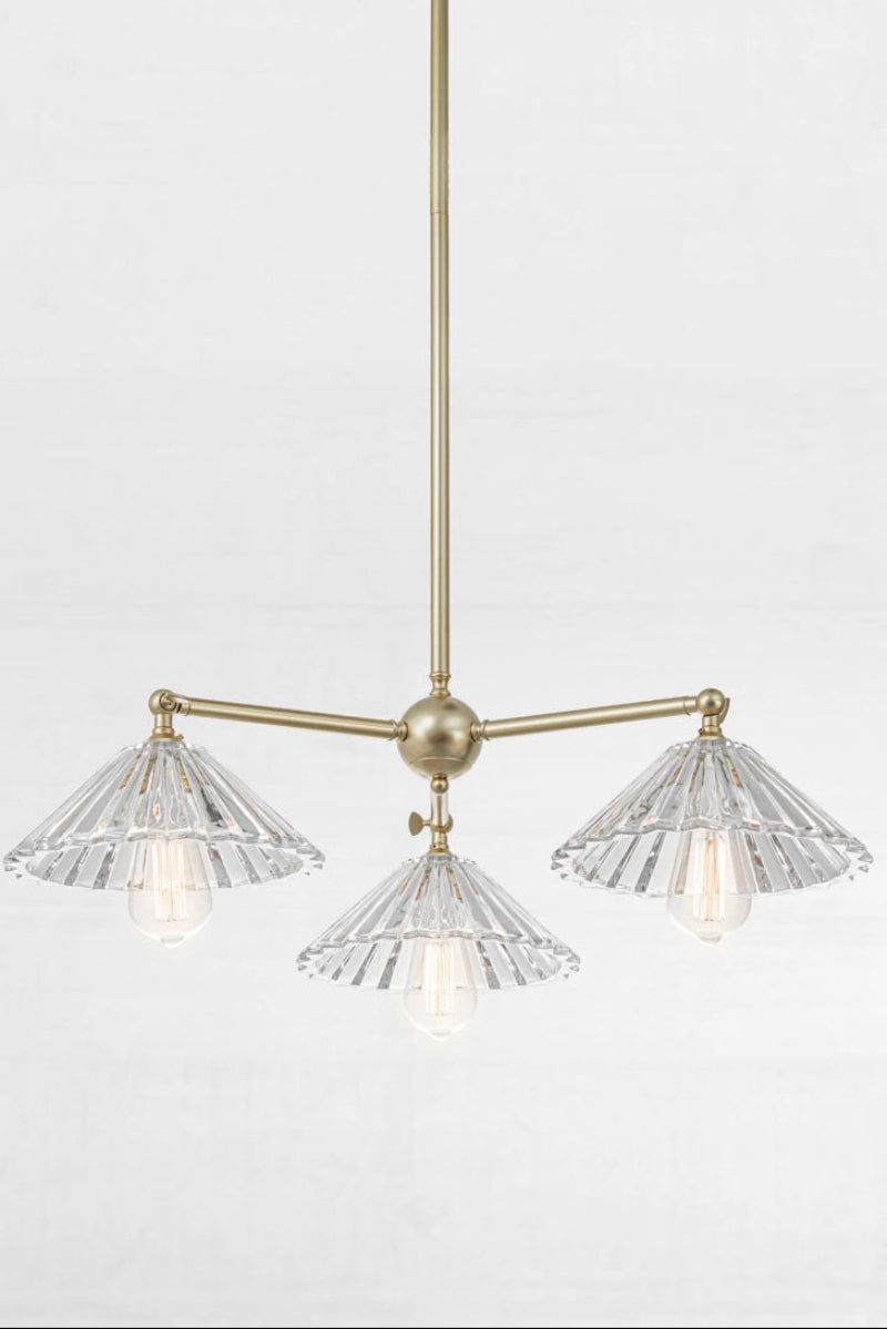 Gold/ Brass three light pendant  with tiltable lampholders and three pleated glass shades. 