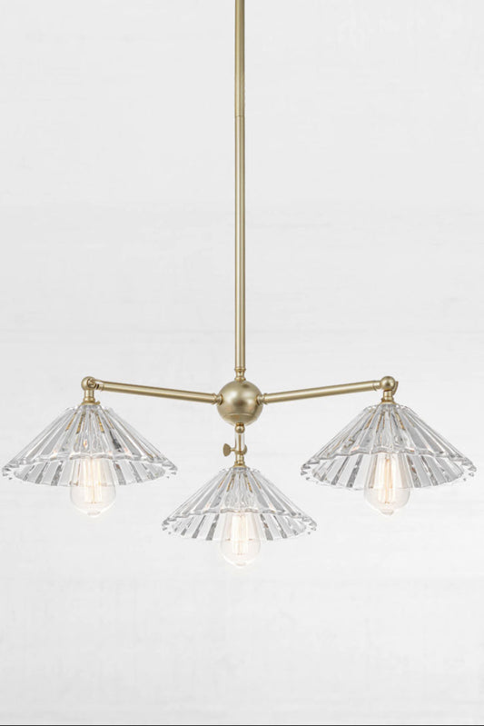 Gold/ Brass three light pendant  with tiltable lampholders and three pleated glass shades. 