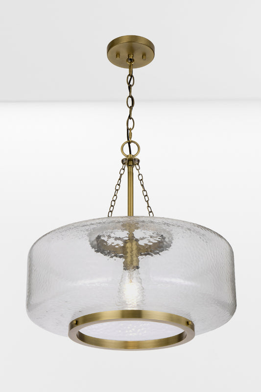 Gold/brass oval shade pendant light with textured glass and chain/cord suspension. 