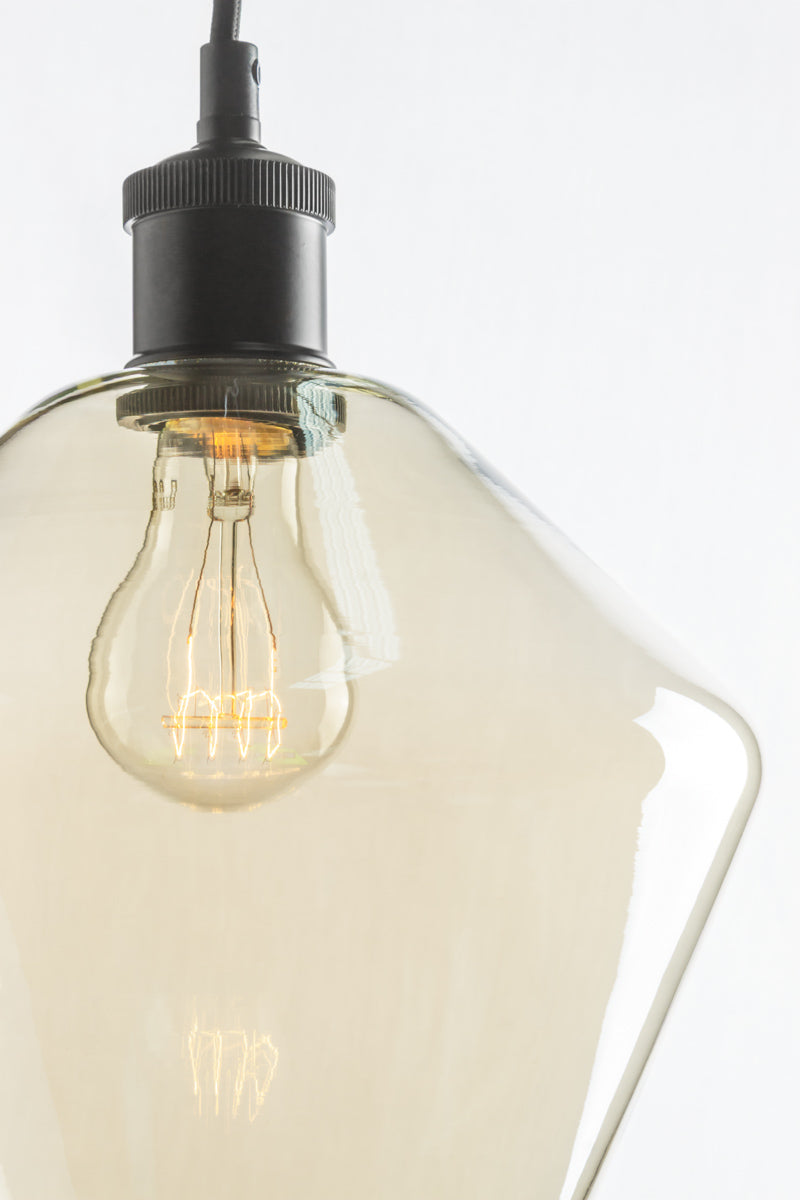 Close up of shade B- Champagne finished glass shade and black lampholder.