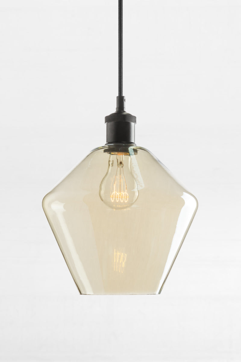 Shade B- Medium almost diamond shaped shade with champagne finishes glass and a black lampholder.  