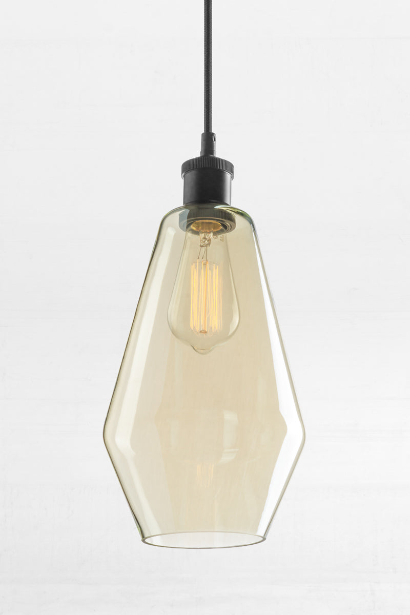 Shade C- Cylindrical shaped shade with champagne finish glass, open end and a black lampholder.  