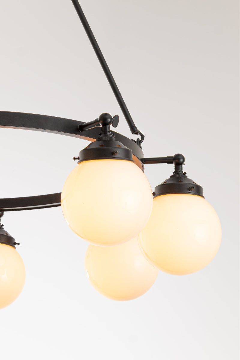 eight-arm metal black frame is accented with tilting lampholders