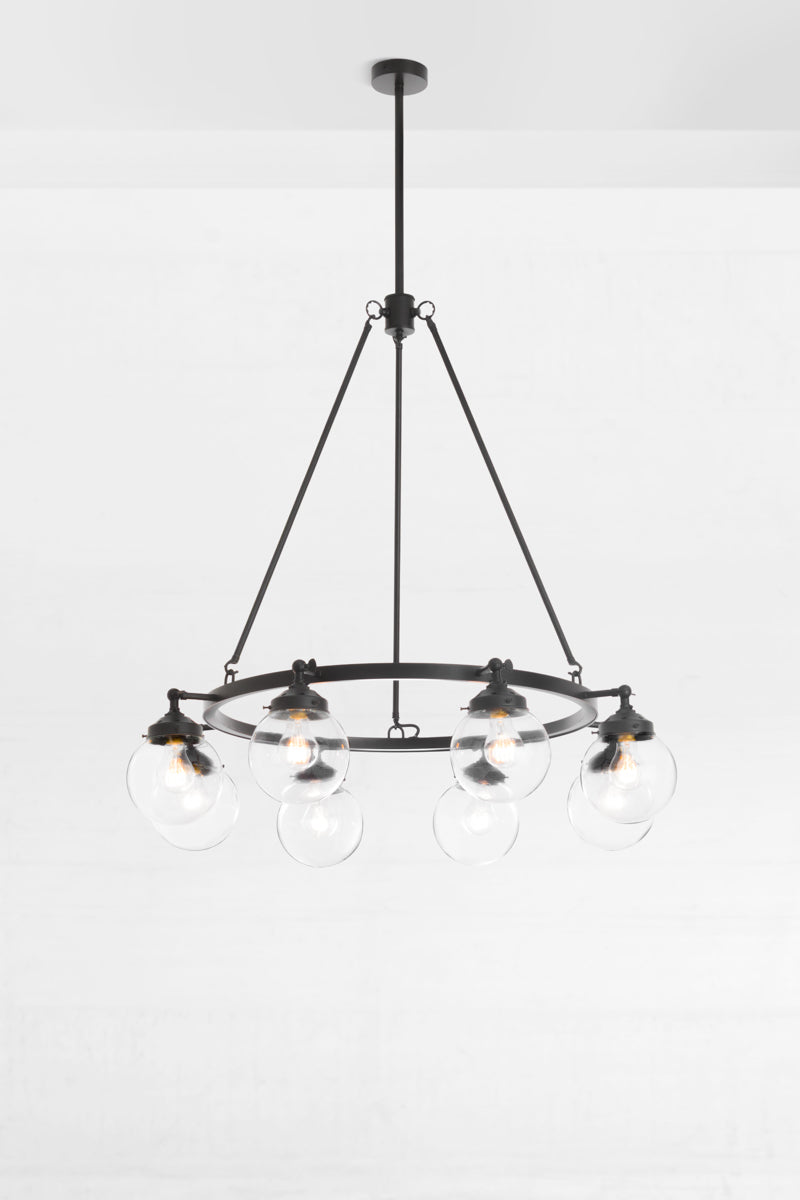 eight-arm metal black frame is accented with 8 clear glass shade spheres. 