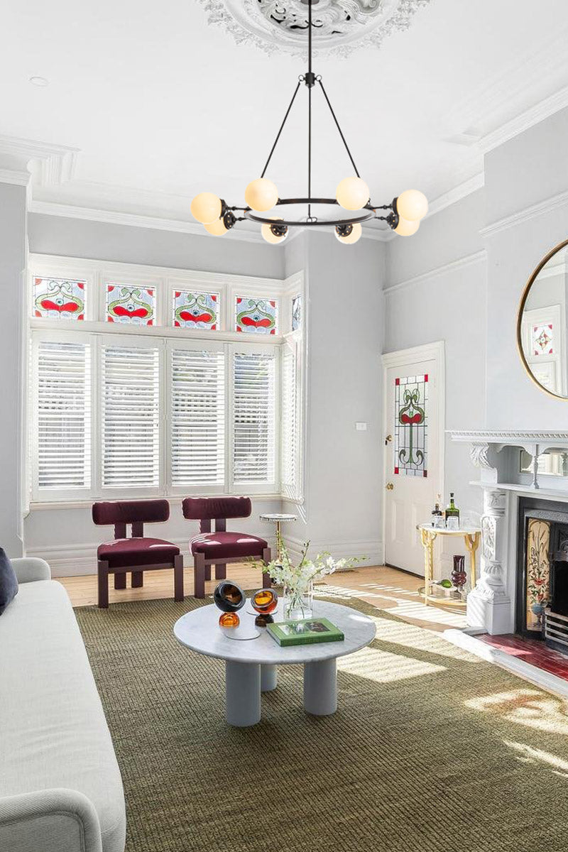 eight-arm metal black frame iin living room of renovated home